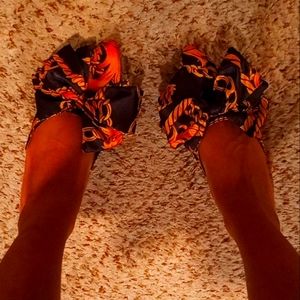 Black and gold casual slip-ons